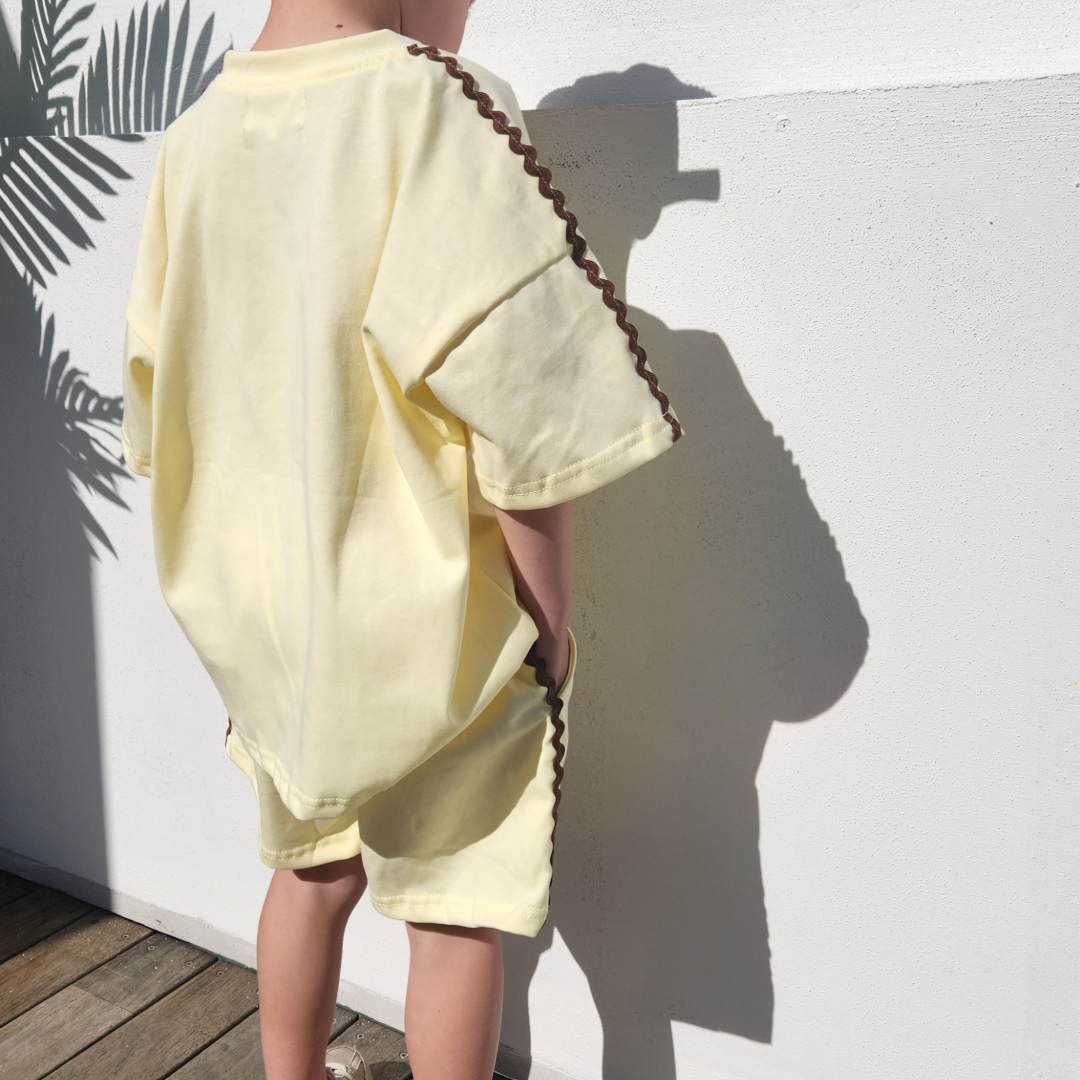 back view of a child wearing buttercup t-shirt and shorts set